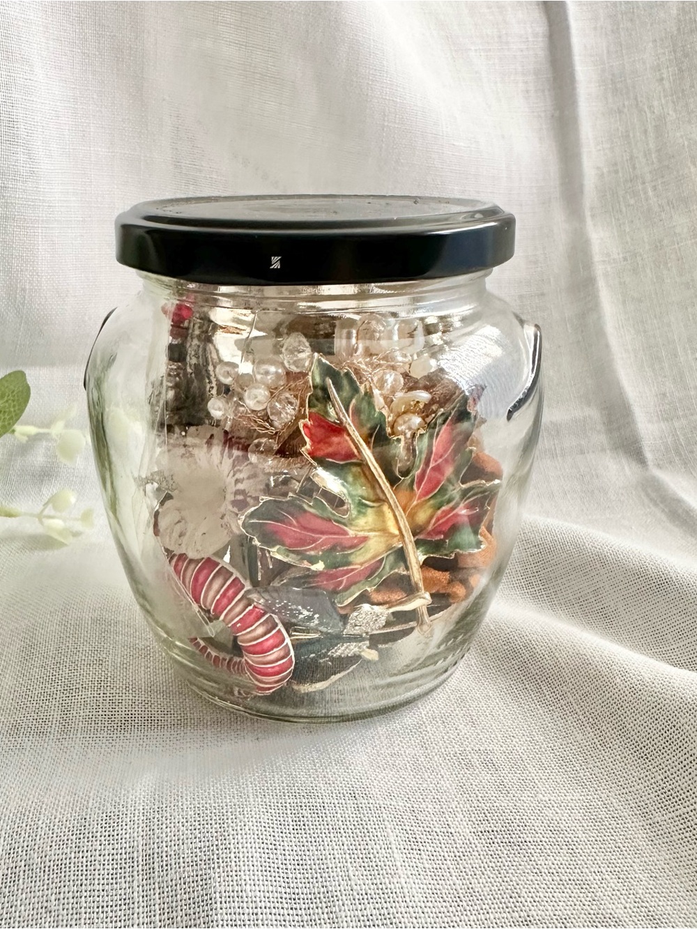 Assortment of brooches, pins, and hair accessories mystery jar